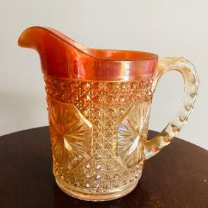 Imperial Star Medallion Carnival Glass pitcher in marigold. Calrnival Glass